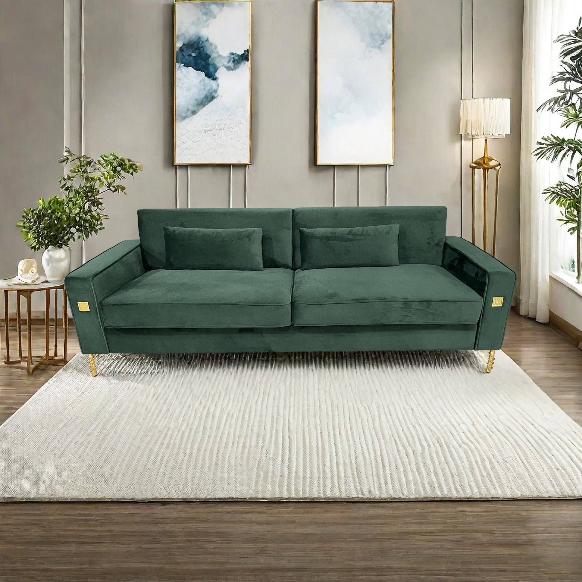 Emerald green velvet sofa with gold legs and decorative accent pillows