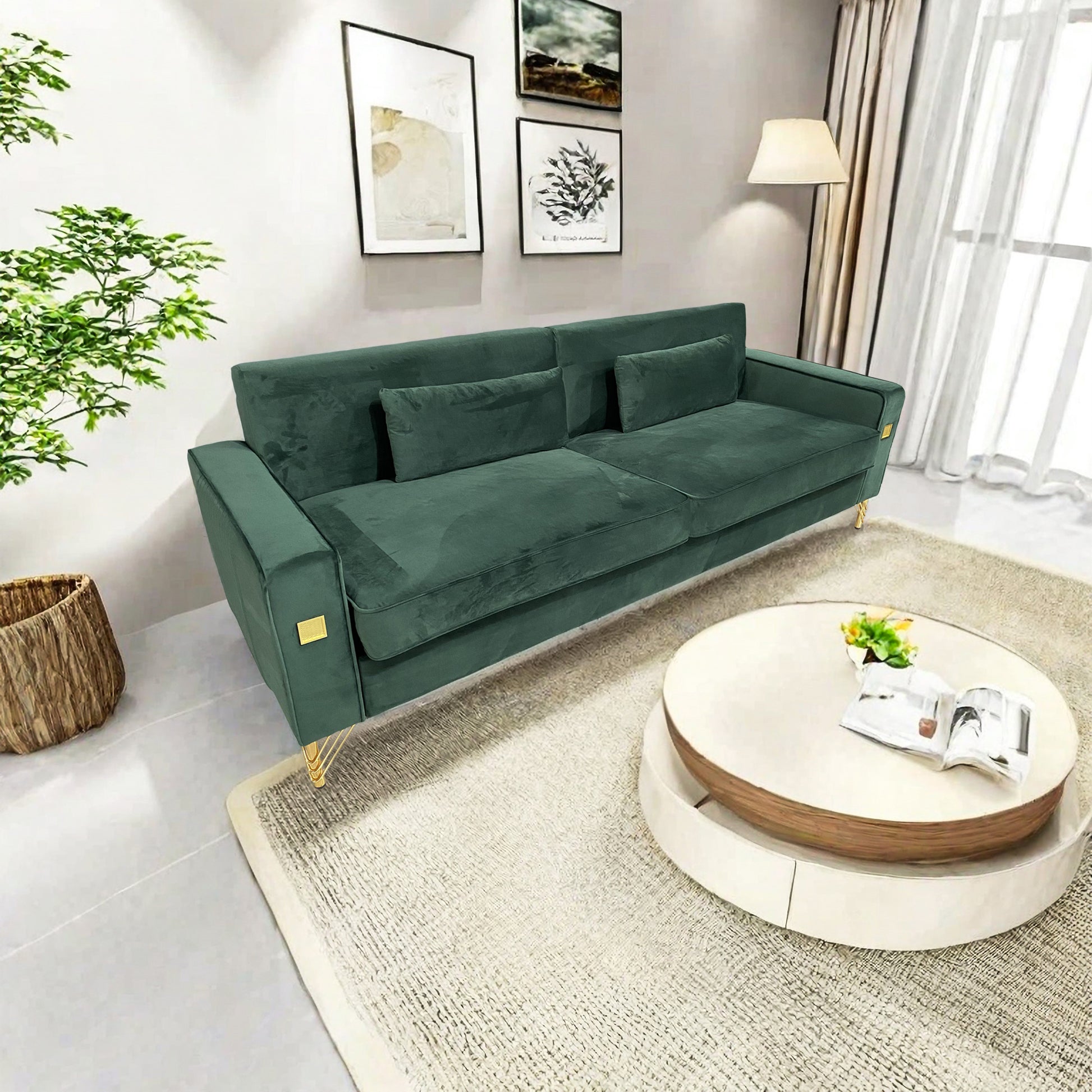 Elegant emerald green velvet sofa with gold legs and matching throw pillows