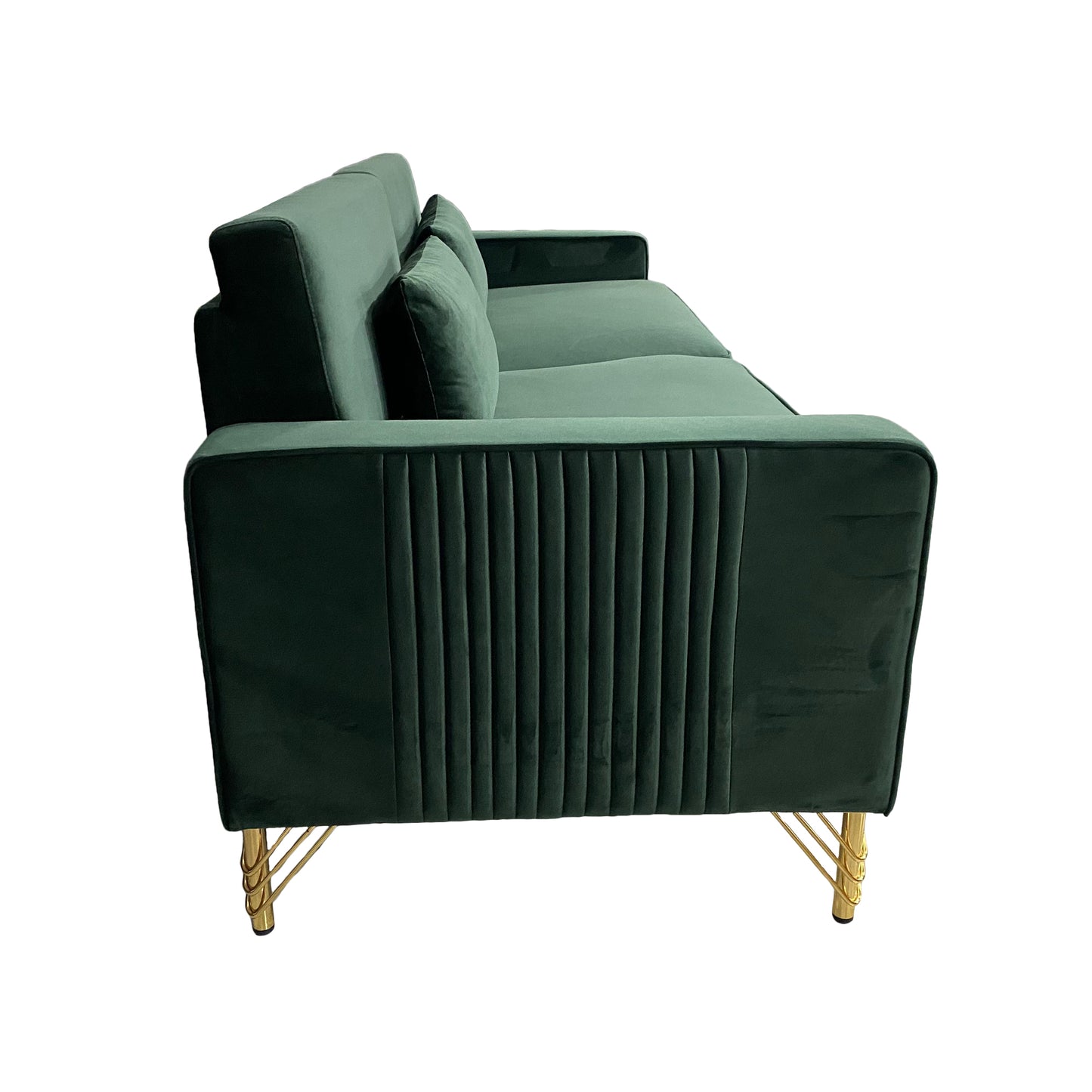 Emerald green velvet sofa with gold legs featuring channel tufting and plush cushions for modern living