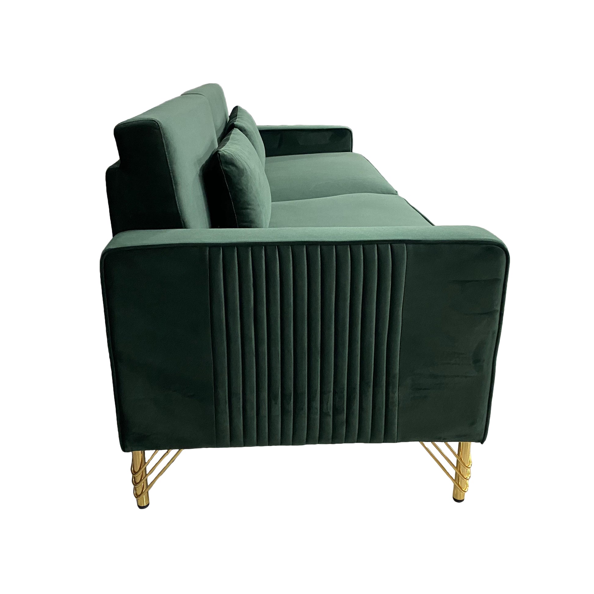 Emerald green velvet sofa with gold legs featuring channel tufting and plush cushions for modern living