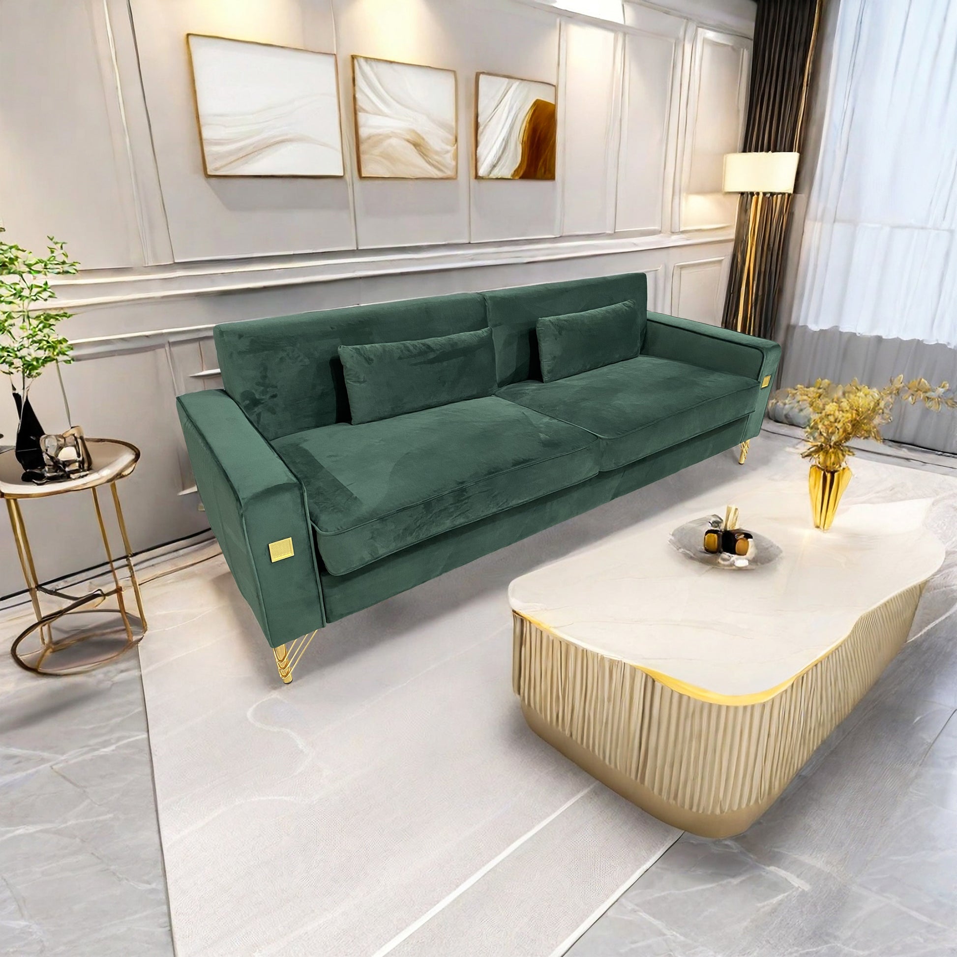 Emerald green velvet sofa with gold accent legs perfect for a modern living room