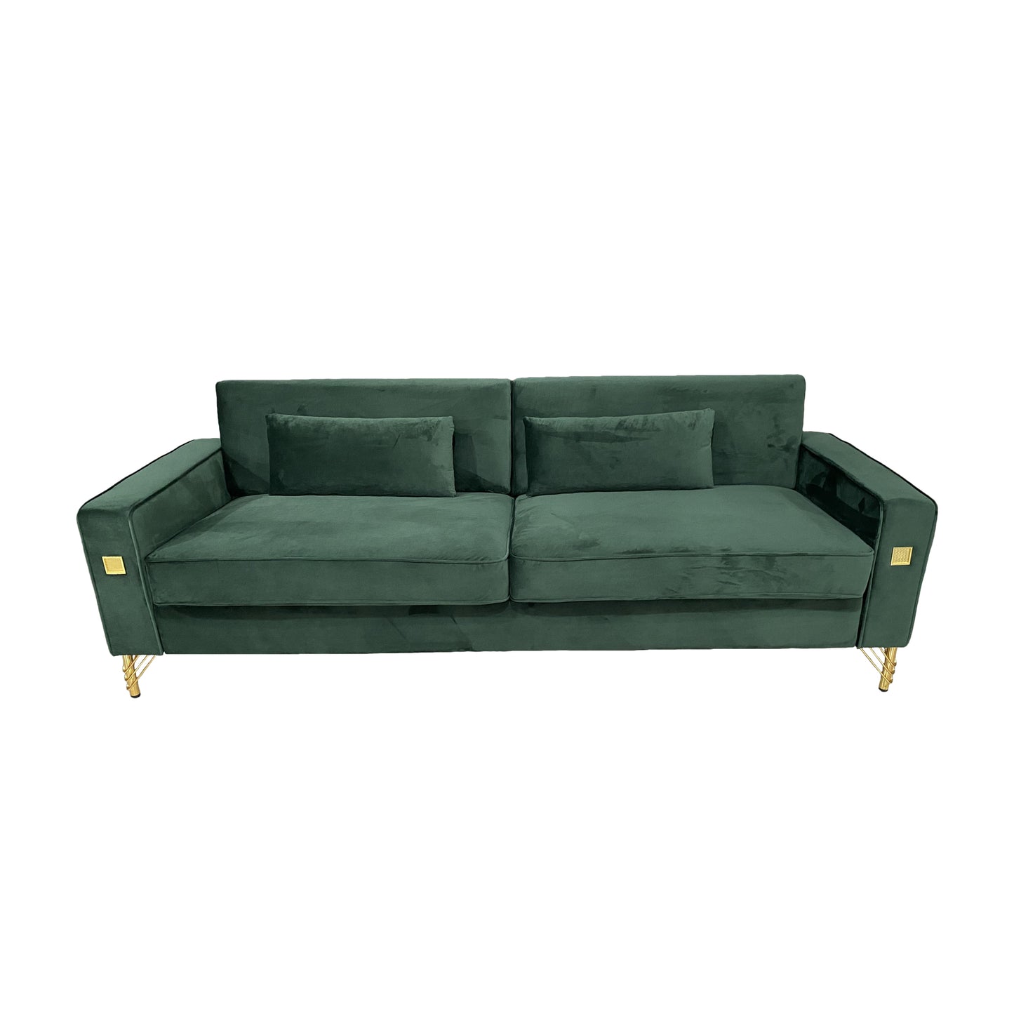 Deep green velvet sofa with gold legs and decorative accents