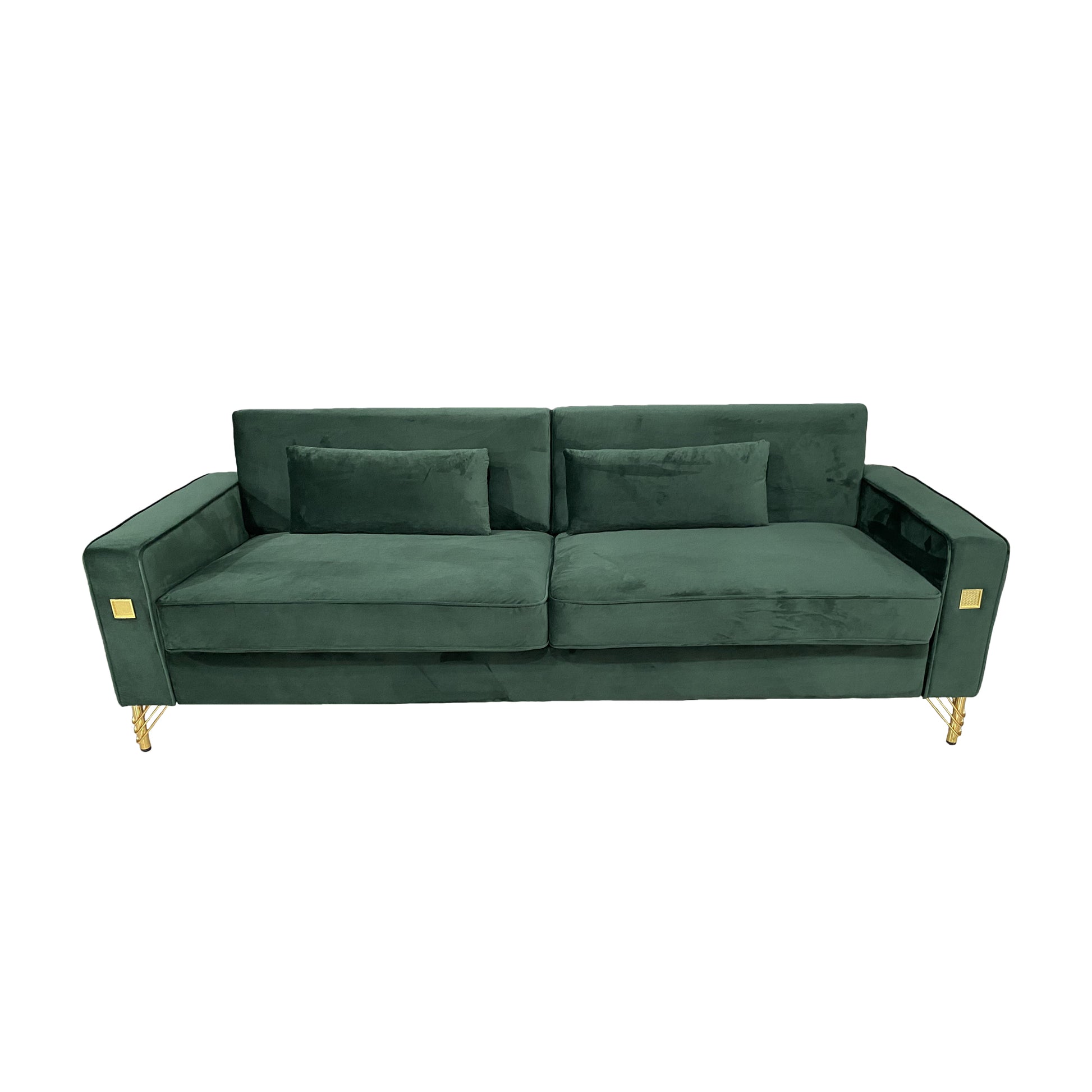 Deep green velvet sofa with gold legs and decorative accents