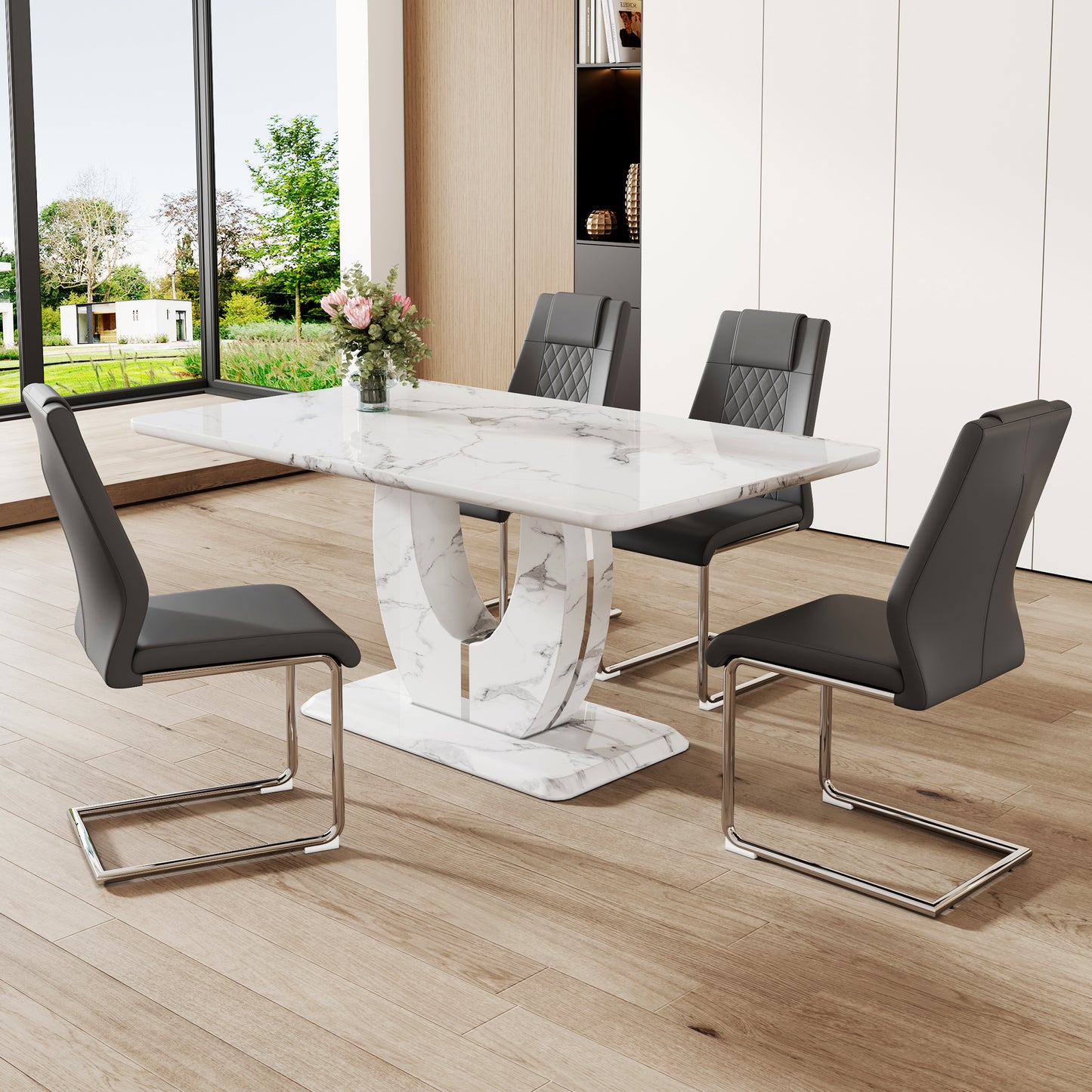Rectangular white marble dining table with a sculpted pedestal base paired with four charcoal faux leather chairs