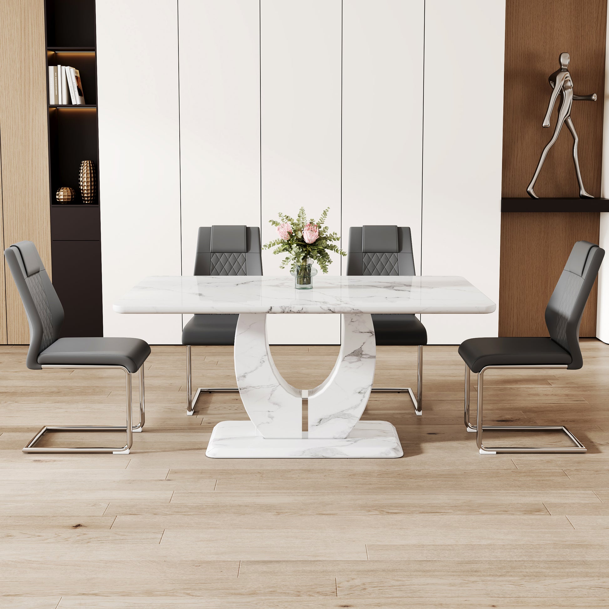 Modern rectangular marble dining table with chrome sled legs and grey upholstered chairs