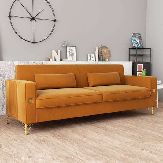 Orange velvet sofa with plush cushions and gold metal legs for a modern living room