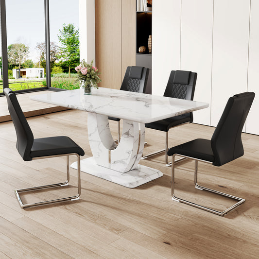 Modern marble dining table with white pedestal base and four black faux leather chairs