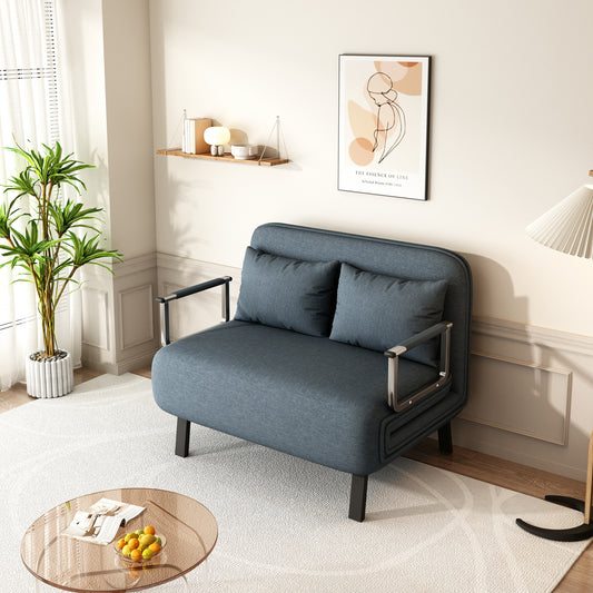 Dark blue upholstered sofa bed with silver armrests and two matching cushions