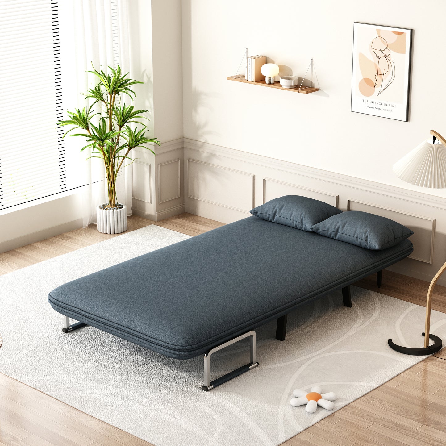 Deep blue linen convertible sofa bed with two pillows ideal for small spaces