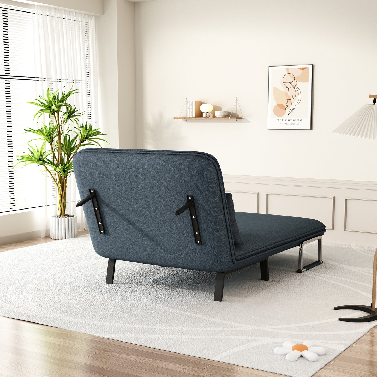 Dark blue fabric sofa bed with chrome legs perfect for small apartments