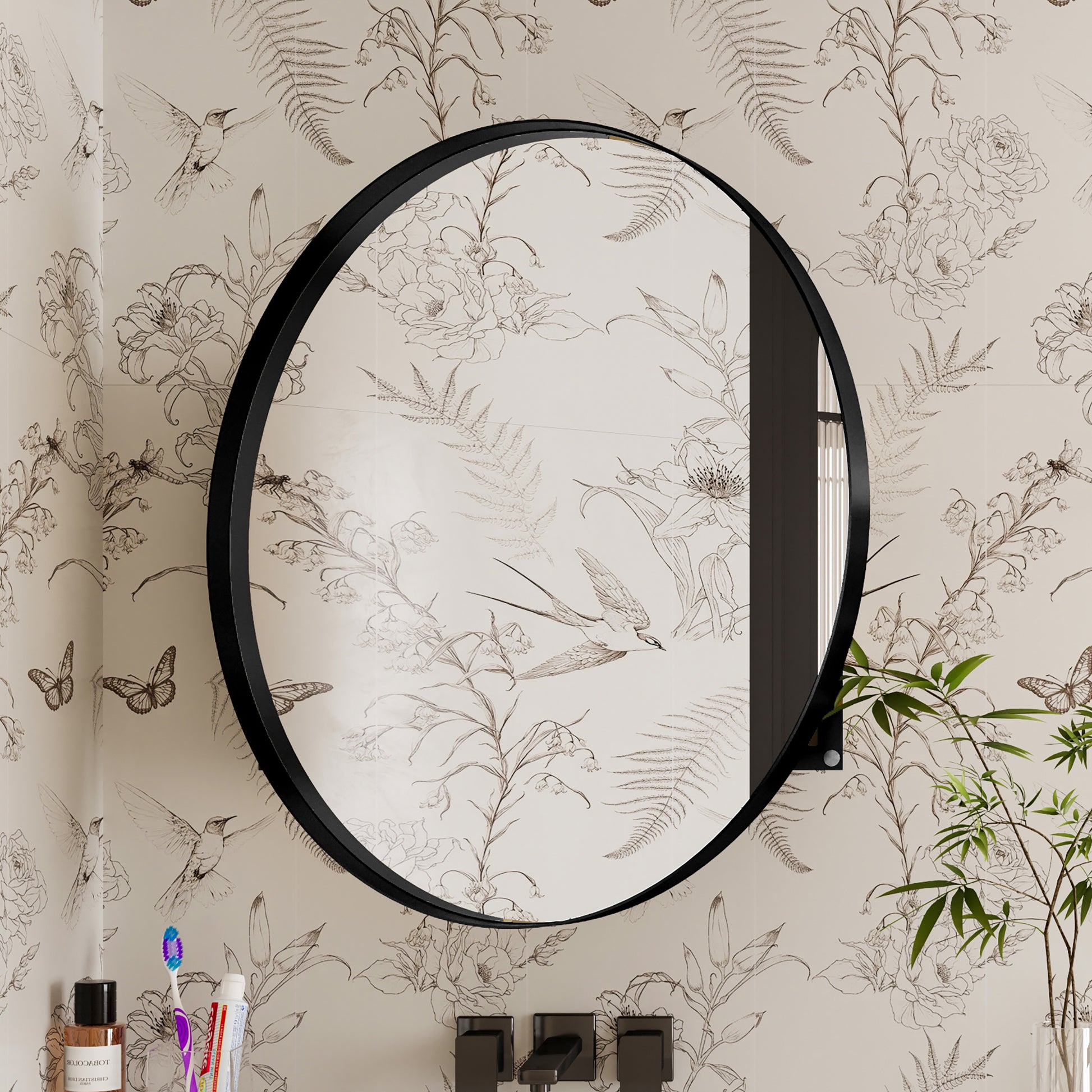 Round black metal framed mirror with botanical sketch wallpaper
