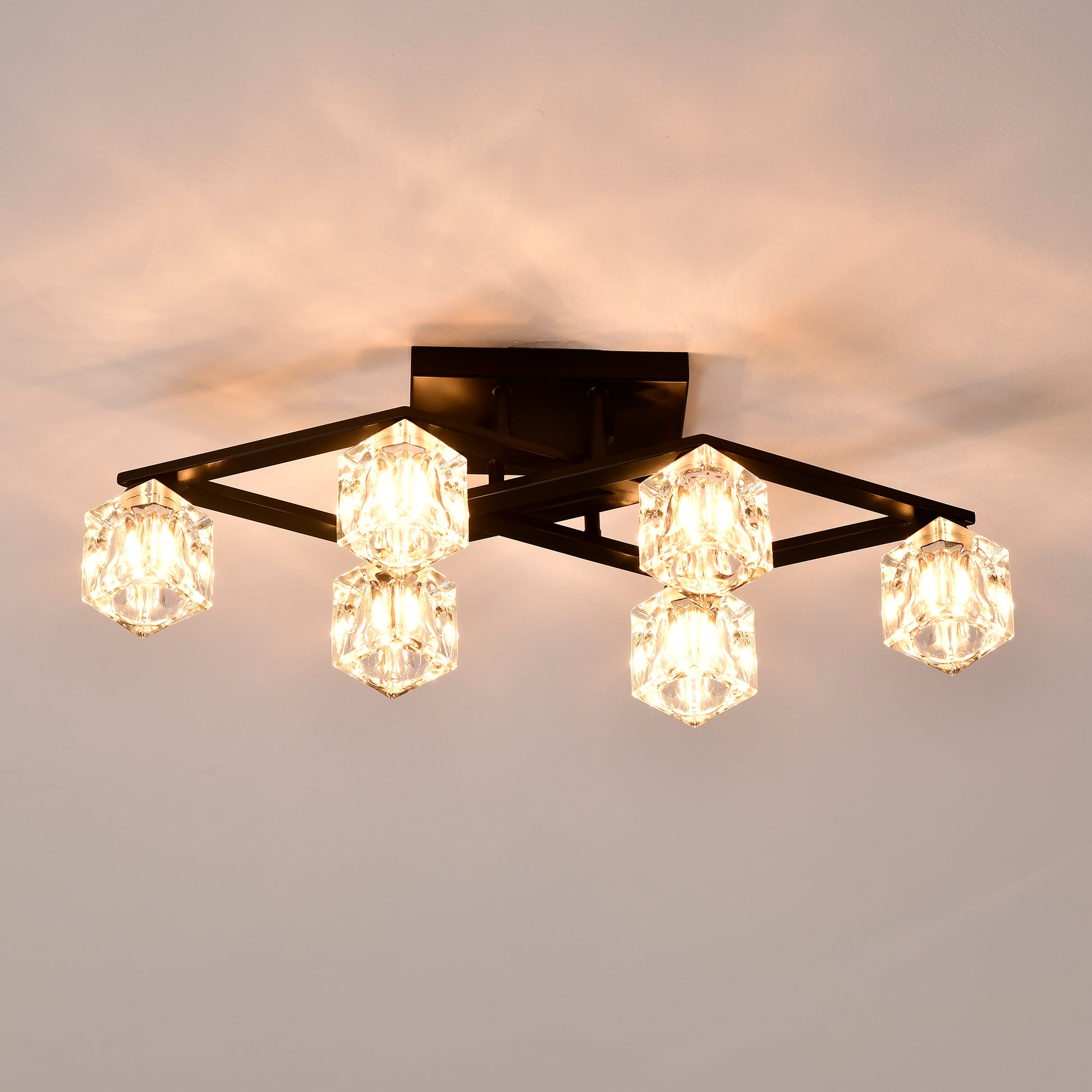 Modern flush mount ceiling light with geometric black frame and crystal cube shades