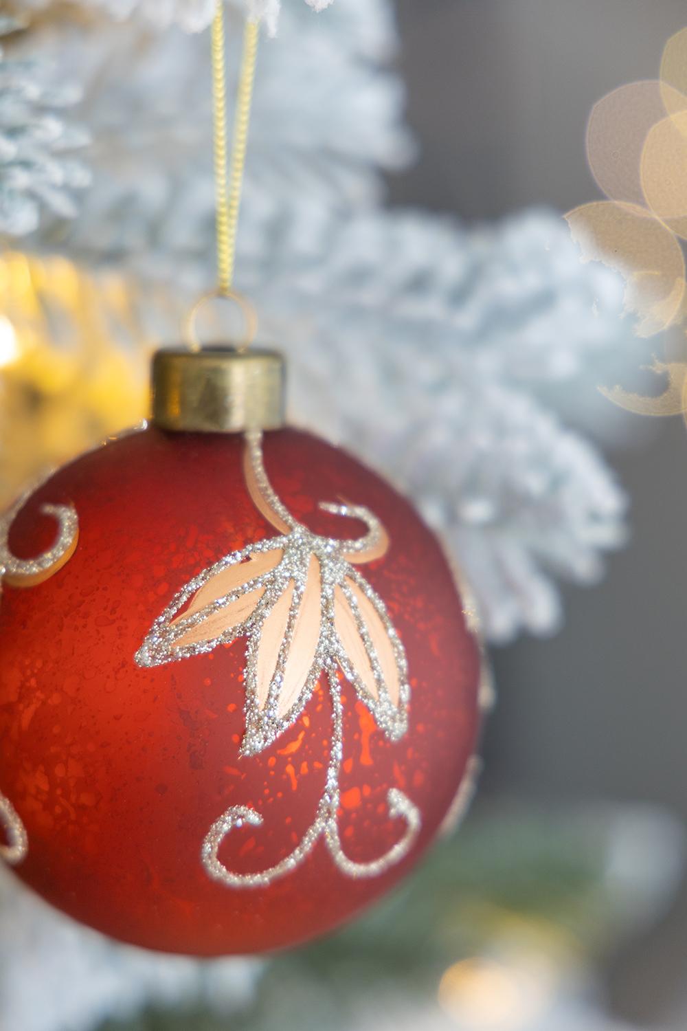 Red frosted glass Christmas ornament with glitter leaf pattern and gold cap  chars