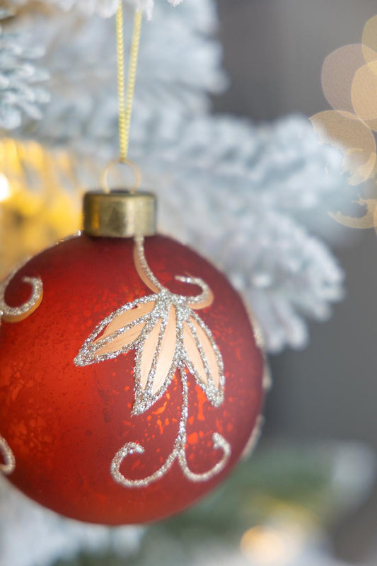 Red frosted glass Christmas ornament with glitter leaf pattern and gold cap  chars