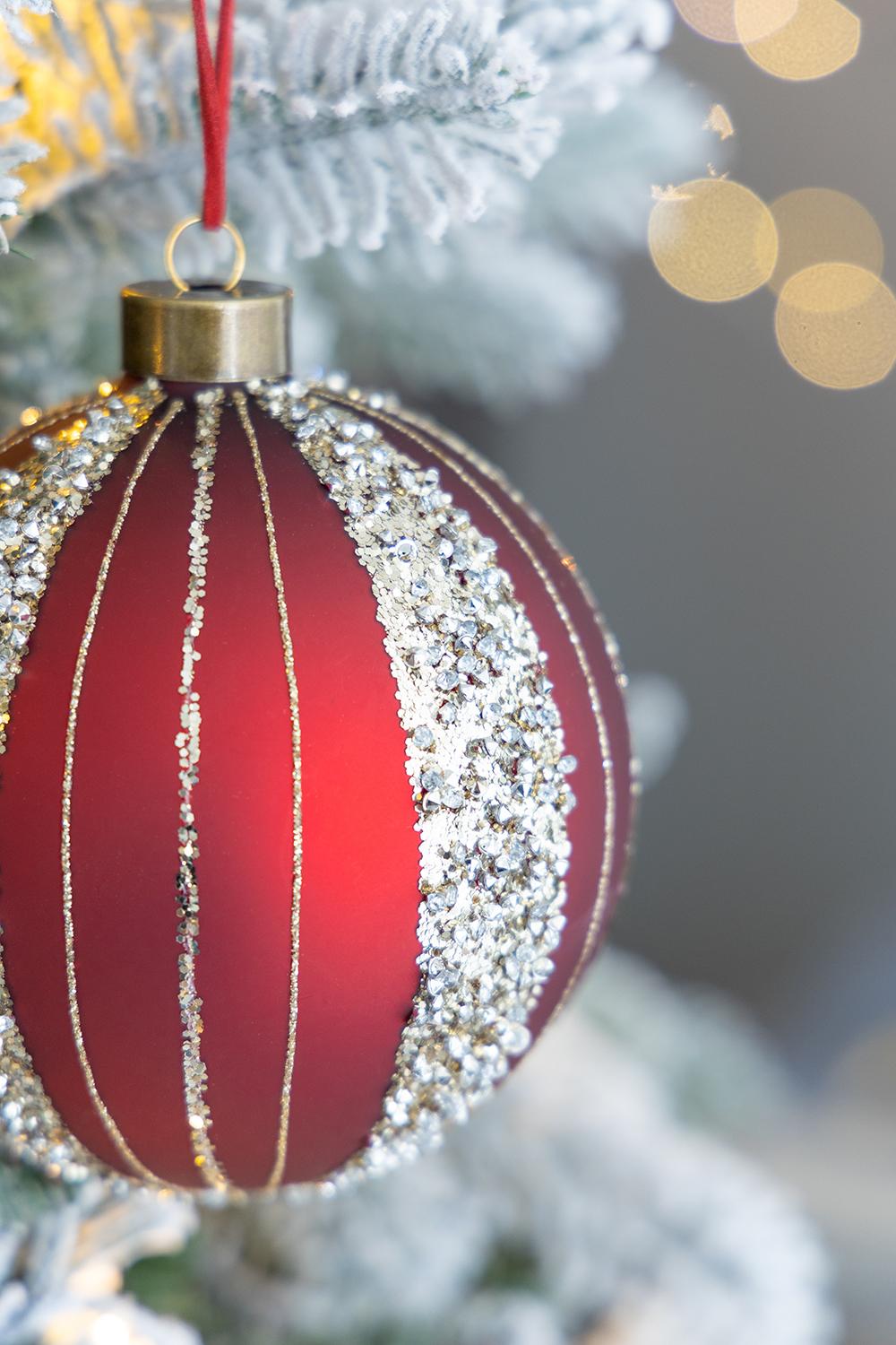 Glittery red glass Christmas ornament with gold stripes ideal for festive tree decor