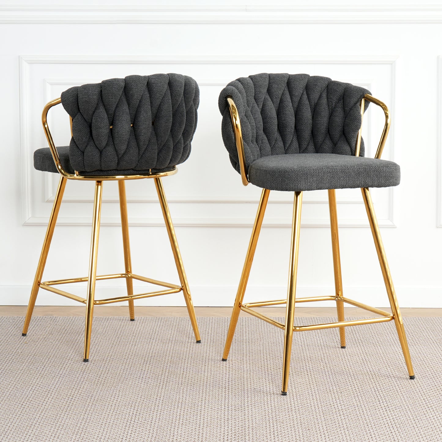 Tufted charcoal bar stool with curved back and gold metal legs for modern kitchen island