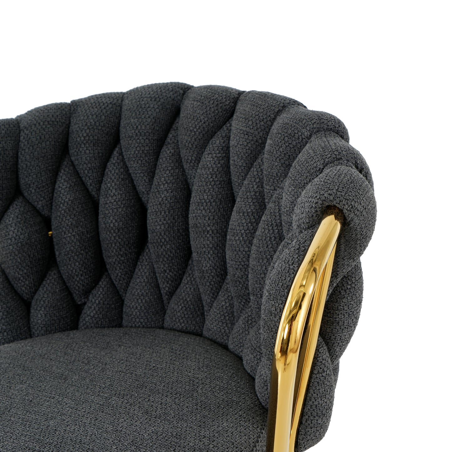 Dark gray upholstered accent chair with braided detail and gold legs