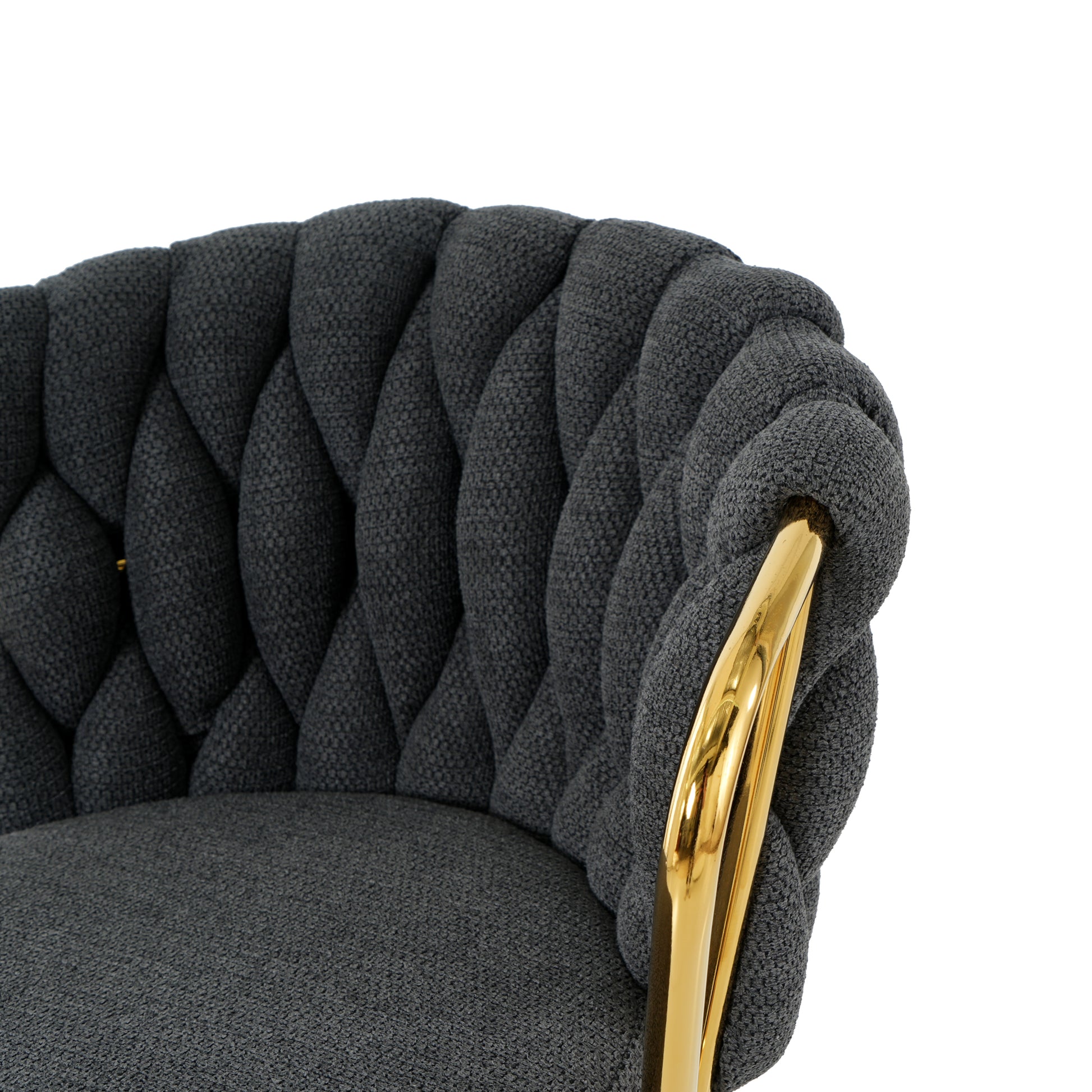 Dark gray upholstered accent chair with braided detail and gold legs