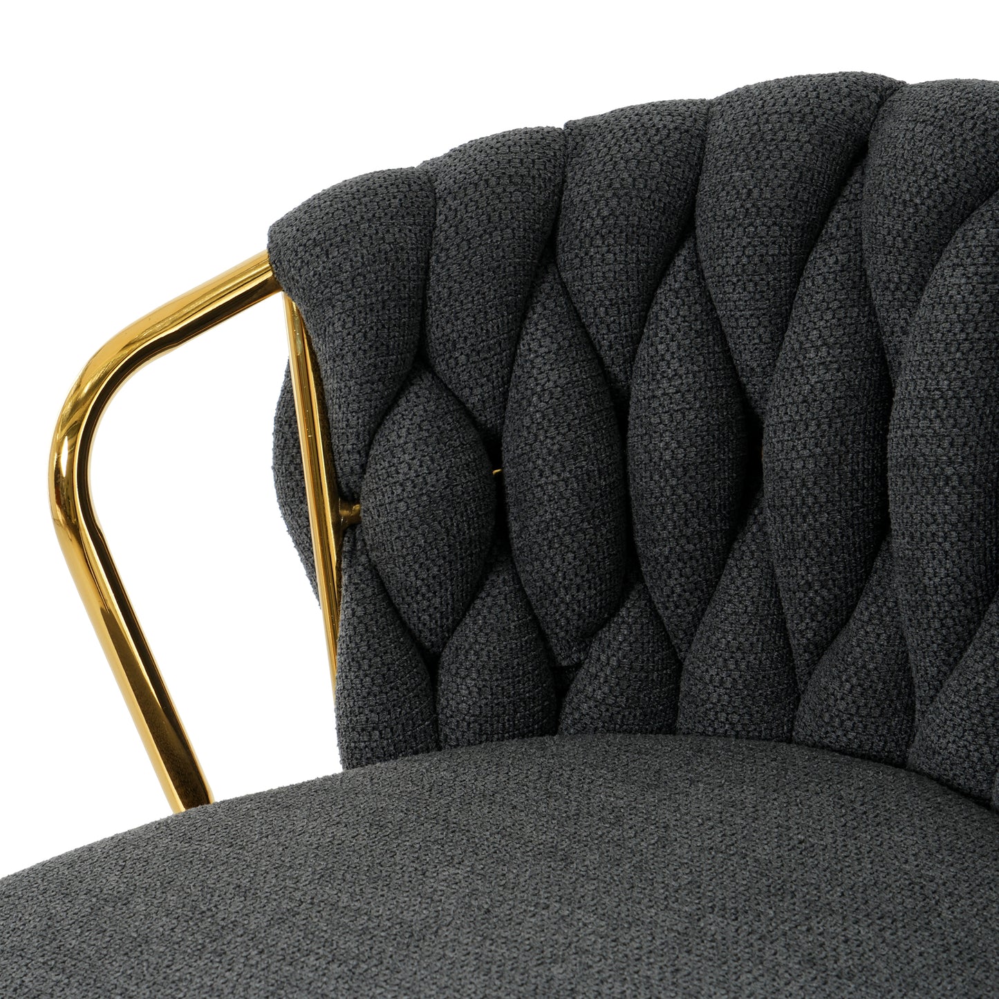 Dark gray upholstered accent chair with tufted back and gold metal legs