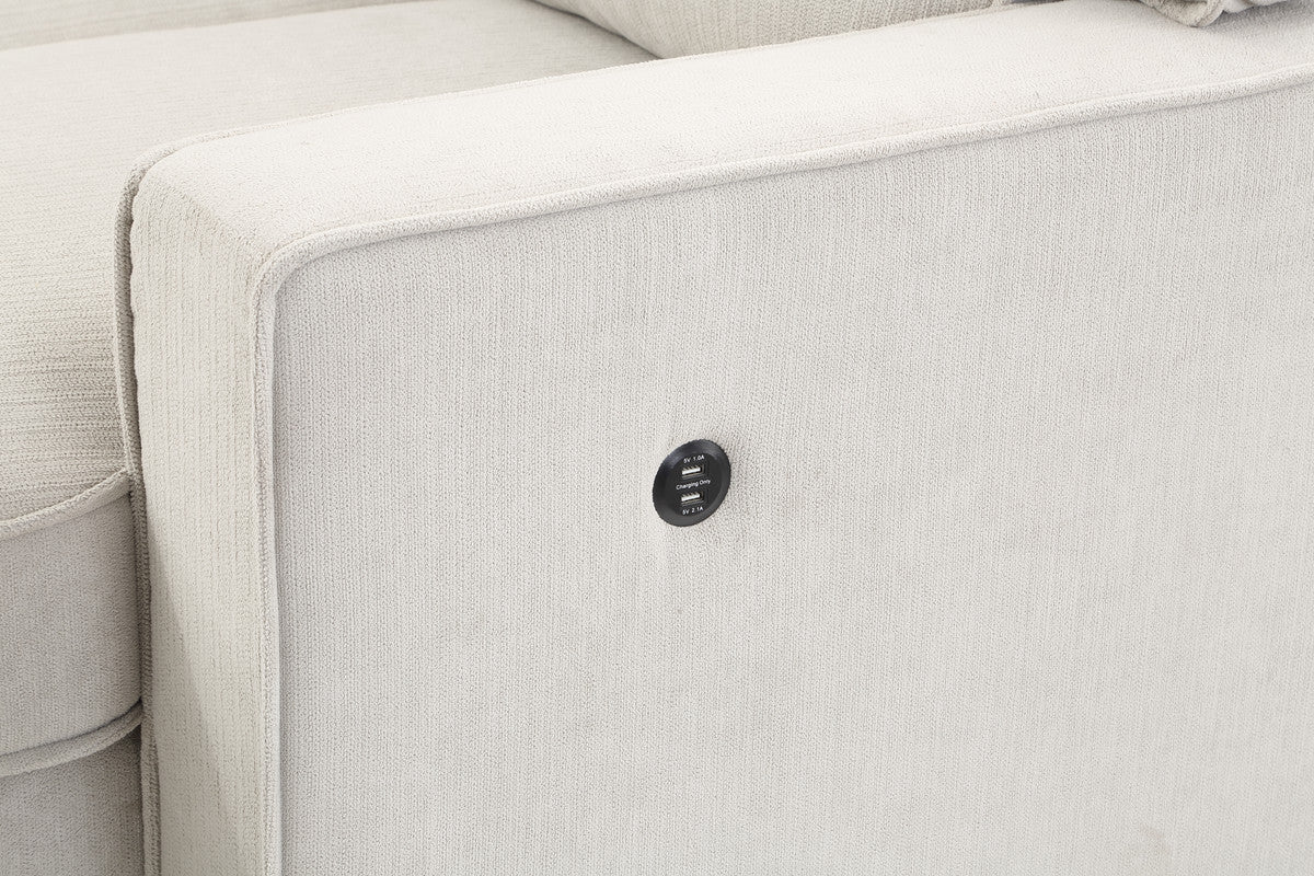 Closeup of light gray textured fabric sofa arm with integrated dual USB charging ports