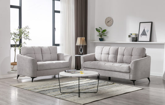 Light grey fabric loveseat with tufted back cushions on black legs