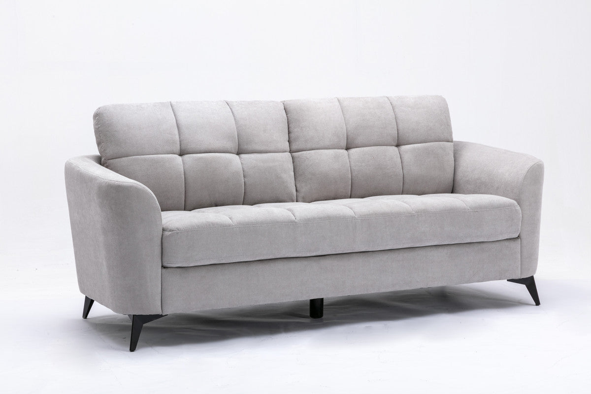 Light grey upholstered sofa with tufted back cushions and black legs