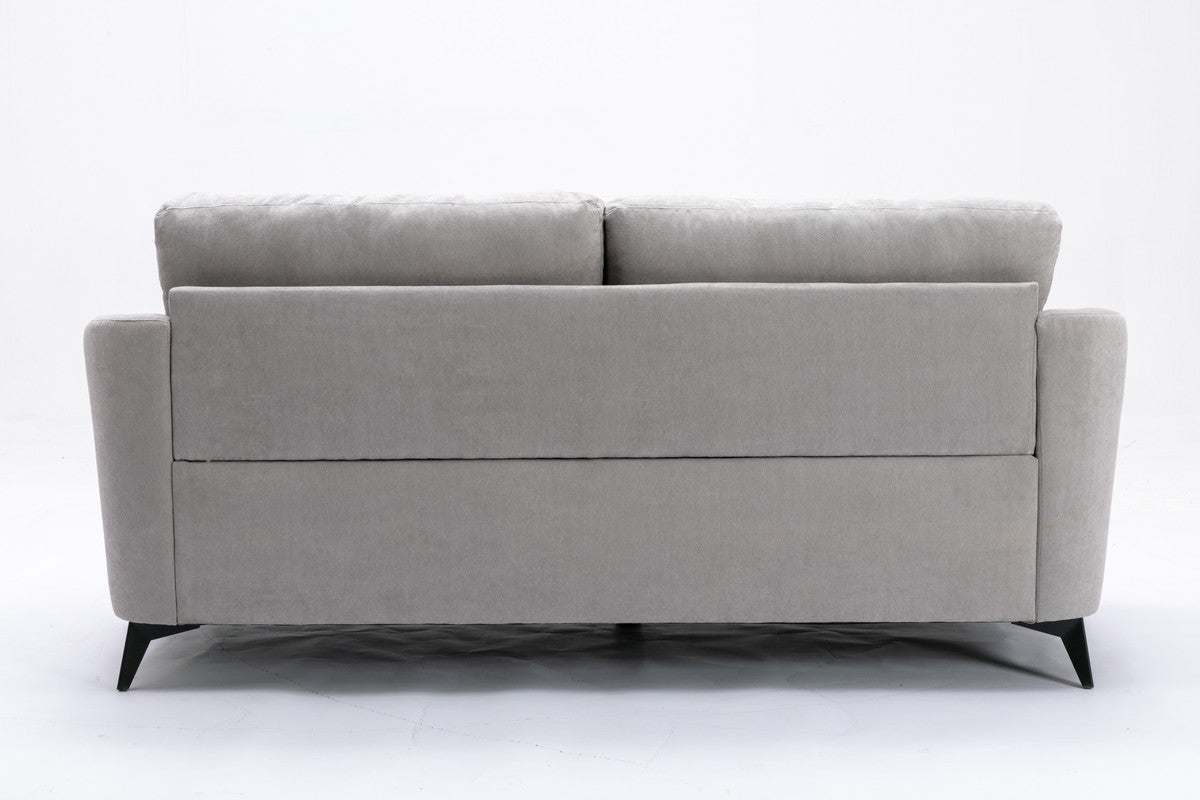 Modern grey fabric sofa with plush cushions and sleek black legs perfect for living rooms