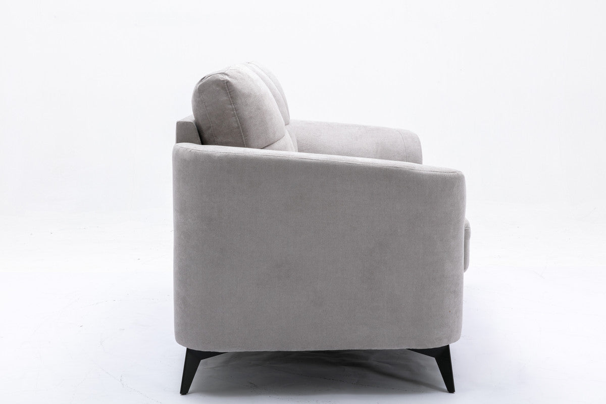 Gray fabric sofa side view modern design with plush cushions and black tapered legs