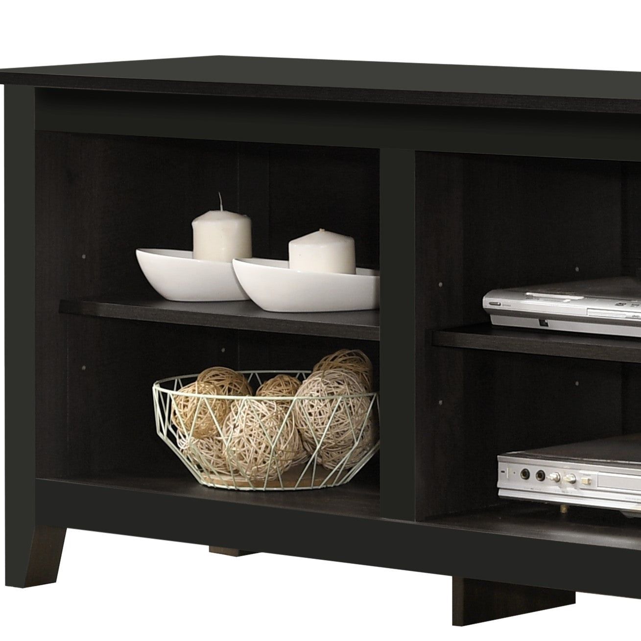 Dark espresso media console with two open shelves holding decorative items and electronics