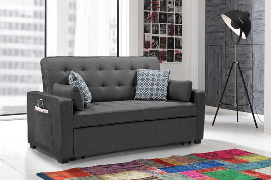 Dark grey tufted sofa with patterned pillows and side pocket for storage