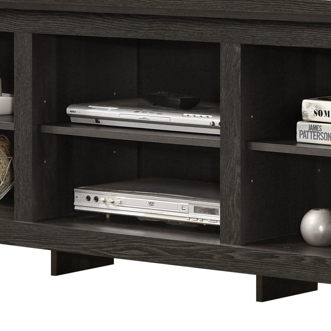 Dark wood entertainment center with two DVD players and books