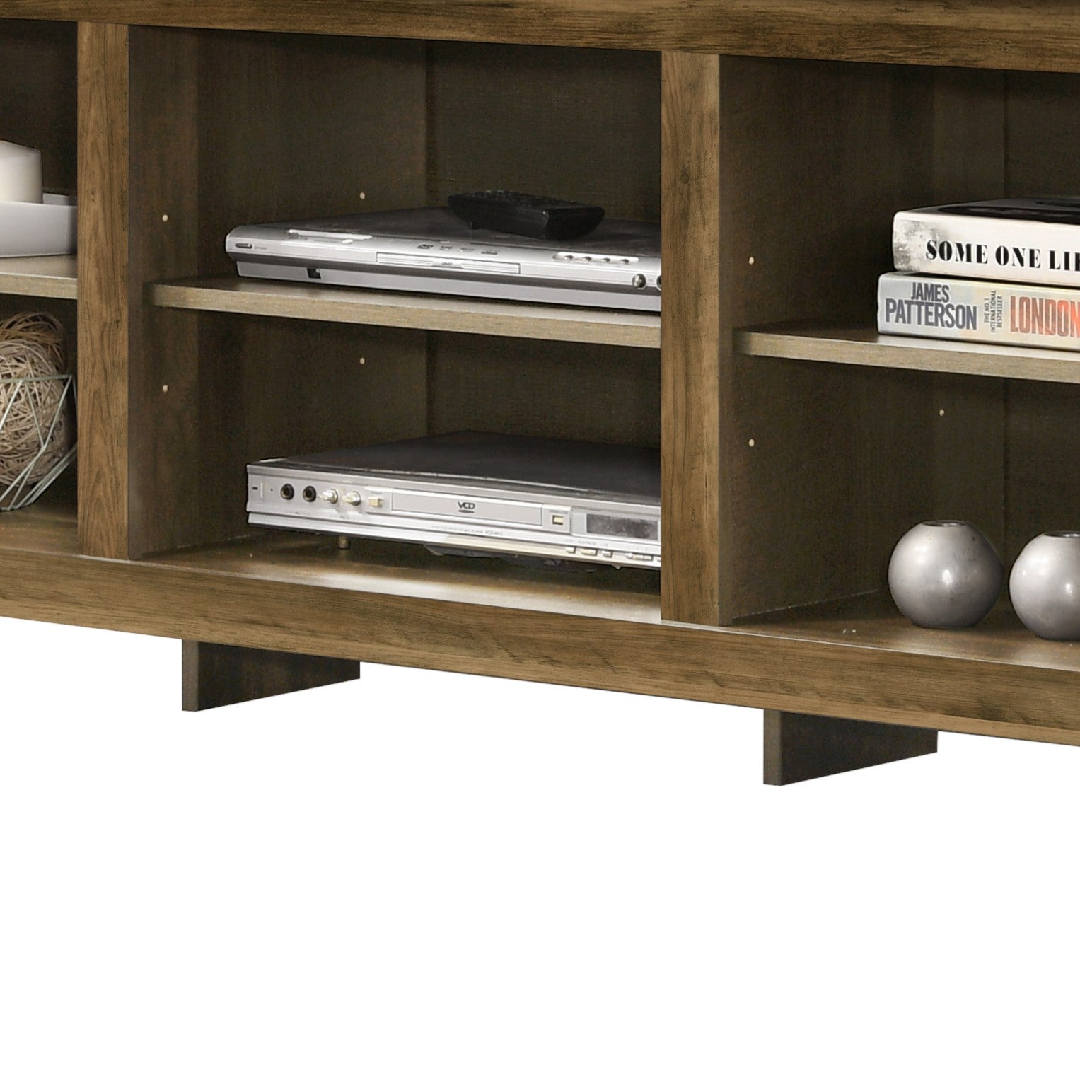 Brown wood media console with DVD player and books on shelves