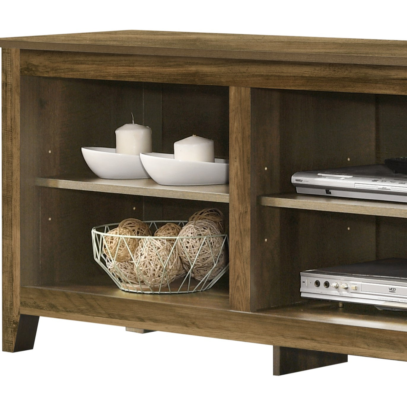 Brown wood TV stand with media shelves holding electronics and decorative spheres