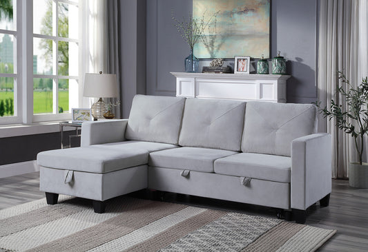 Light gray fabric sectional sofa with tufted cushions and storage chaise