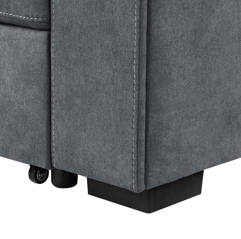 Closeup of a dark gray fabric sofa corner with white stitching and black block feet