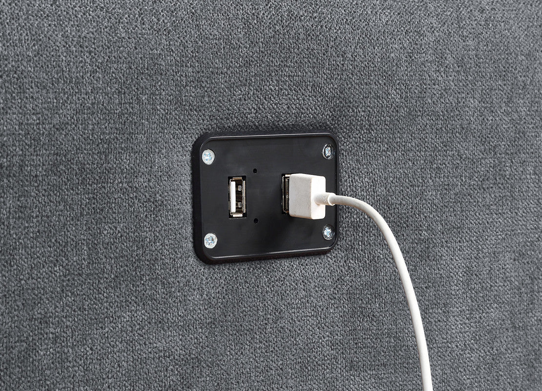 Embedded black dual USB charging port with one cable connected