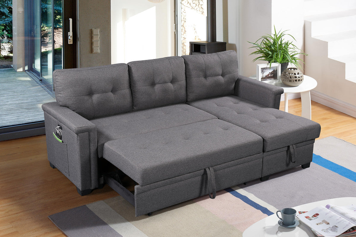 Dark grey sectional sofa bed with tufted cushions and storage chaise lounge