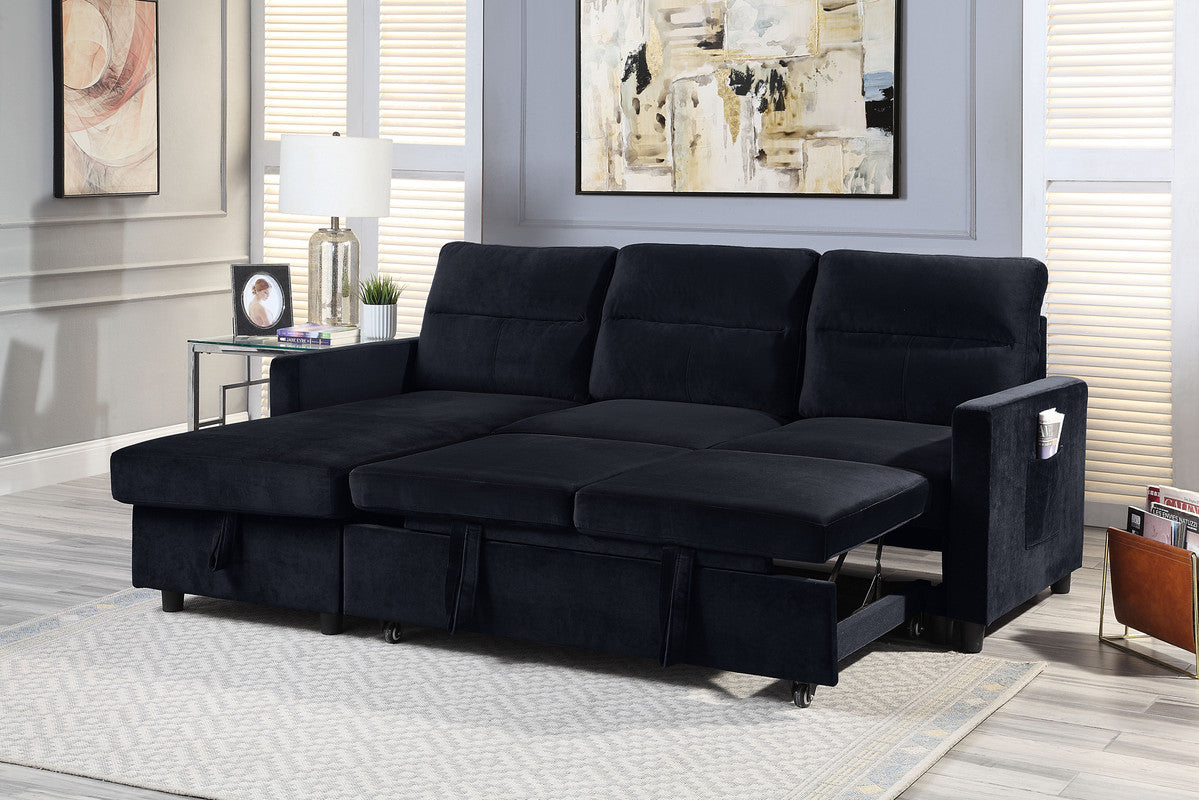 Deep navy velvet sectional sofa convertible into a pullout bed for guest accommodation
