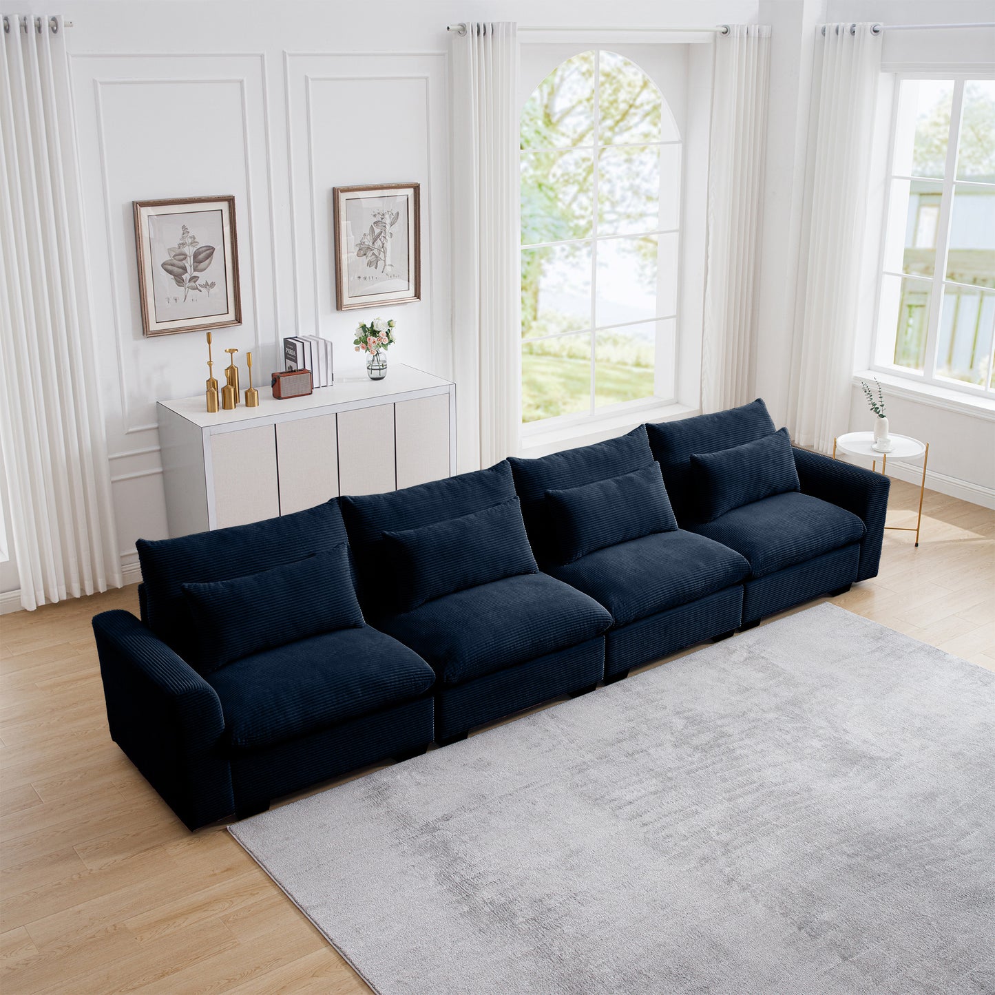 Plush navy corduroy sectional sofa with deep seats and matching throw pillows