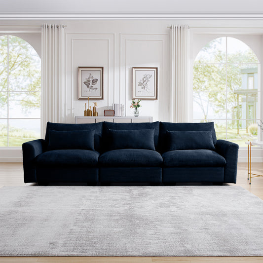Navy blue corduroy sectional sofa with plush cushions in a modern living room setting