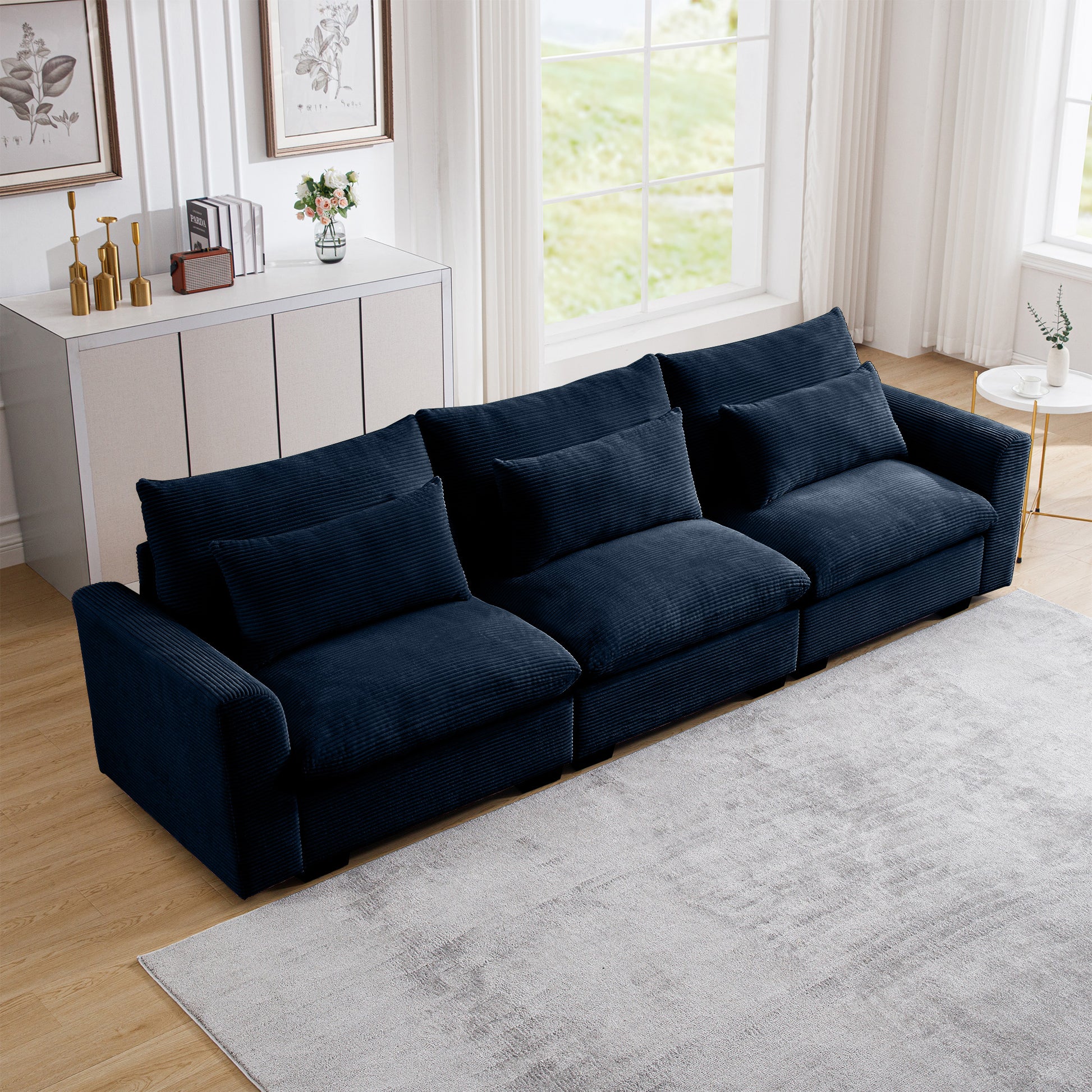 Navy blue corduroy sectional sofa with plush cushions for a comfortable living room