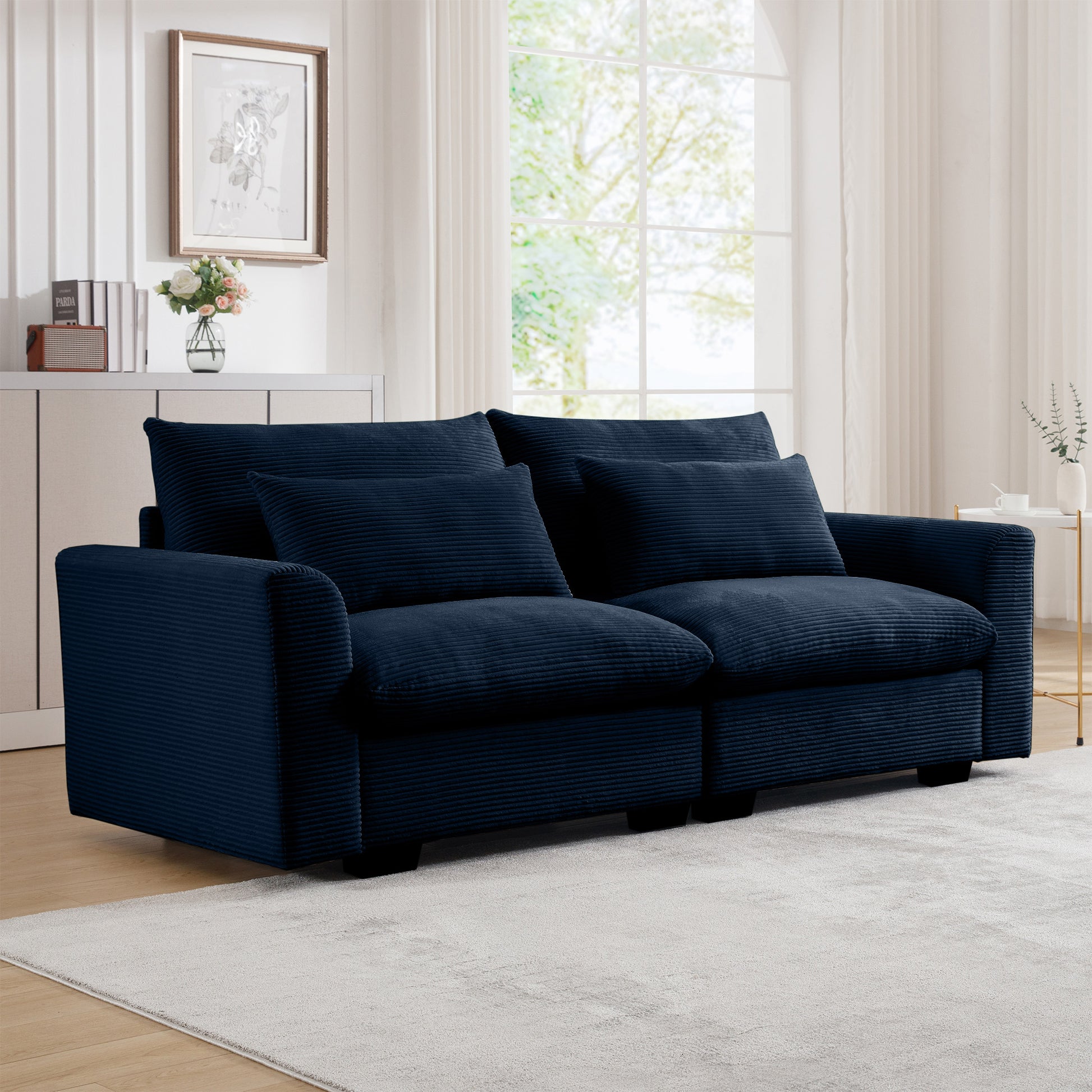 Plush navy blue corduroy sofa with accent pillows perfect for modern living rooms