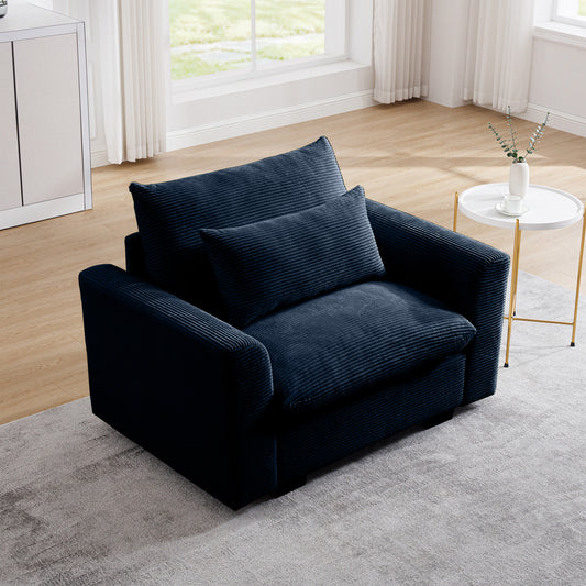 Plush navy blue corduroy armchair with textured cushions for comfortable seating