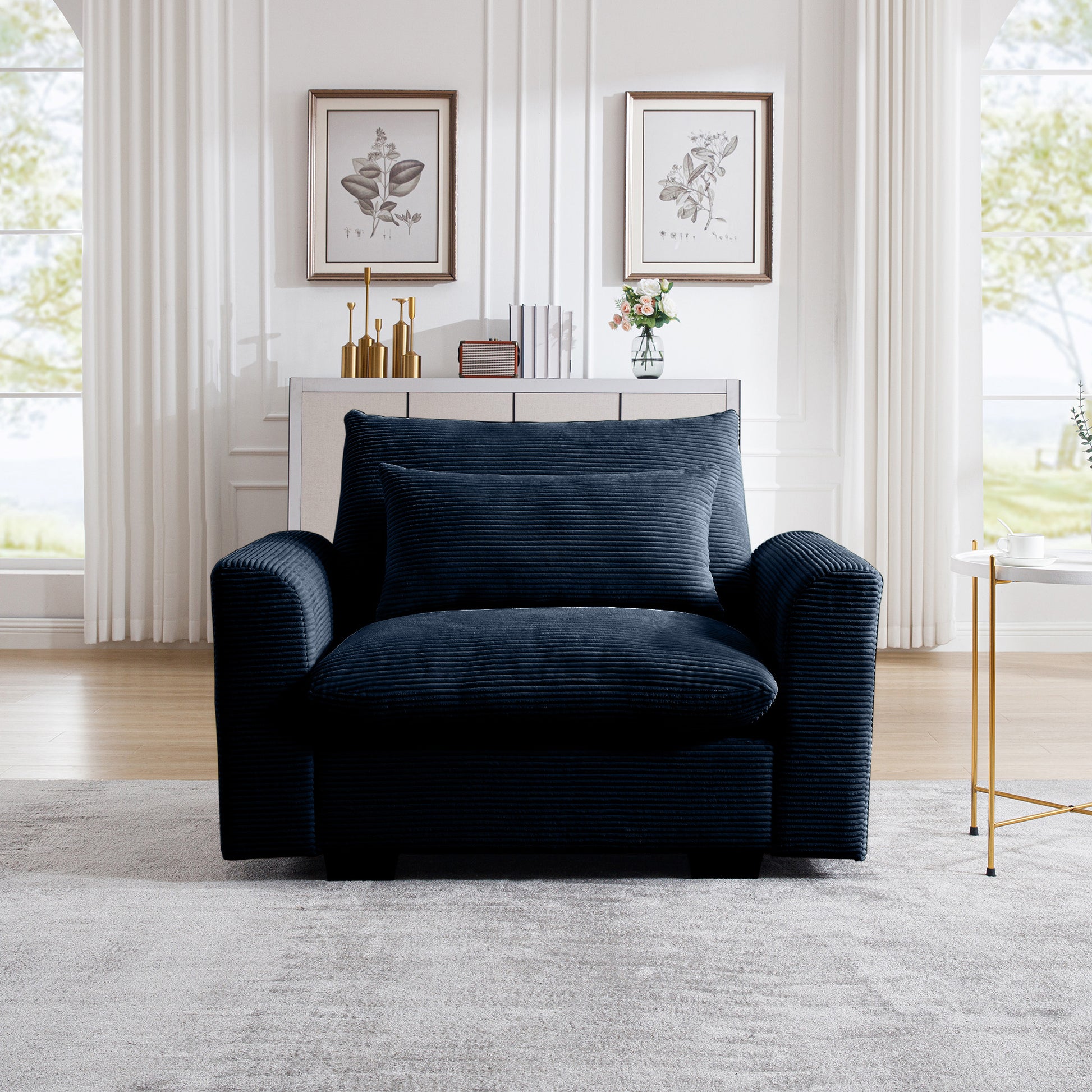 Cozy navy blue corduroy armchair with plush cushions for ultimate relaxation