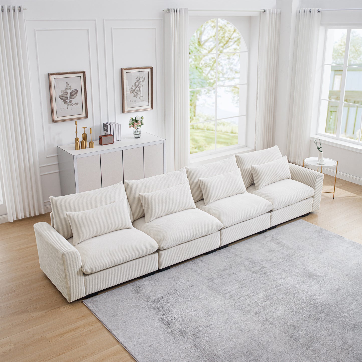 Plush white corduroy sectional sofa with deep seats and plush pillows perfect for modern living rooms
