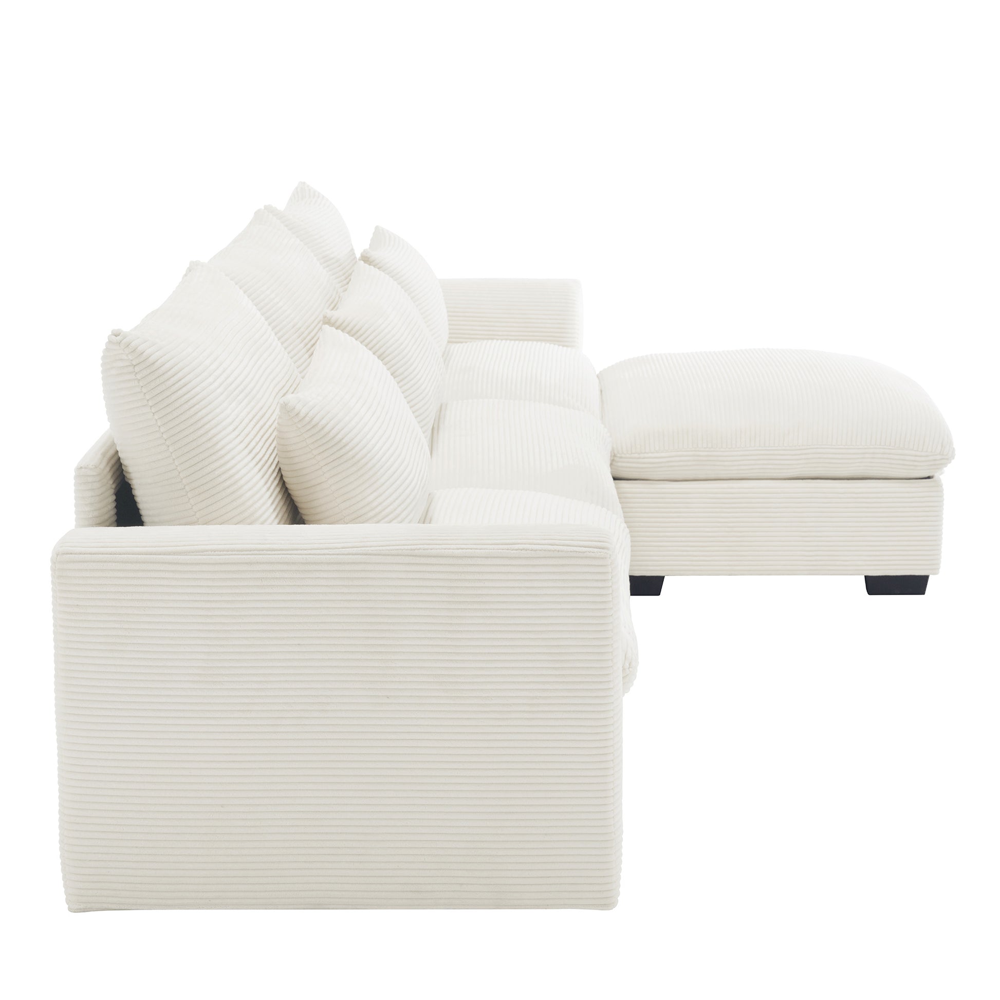 Cream corduroy sectional sofa with plush pillows and chaise