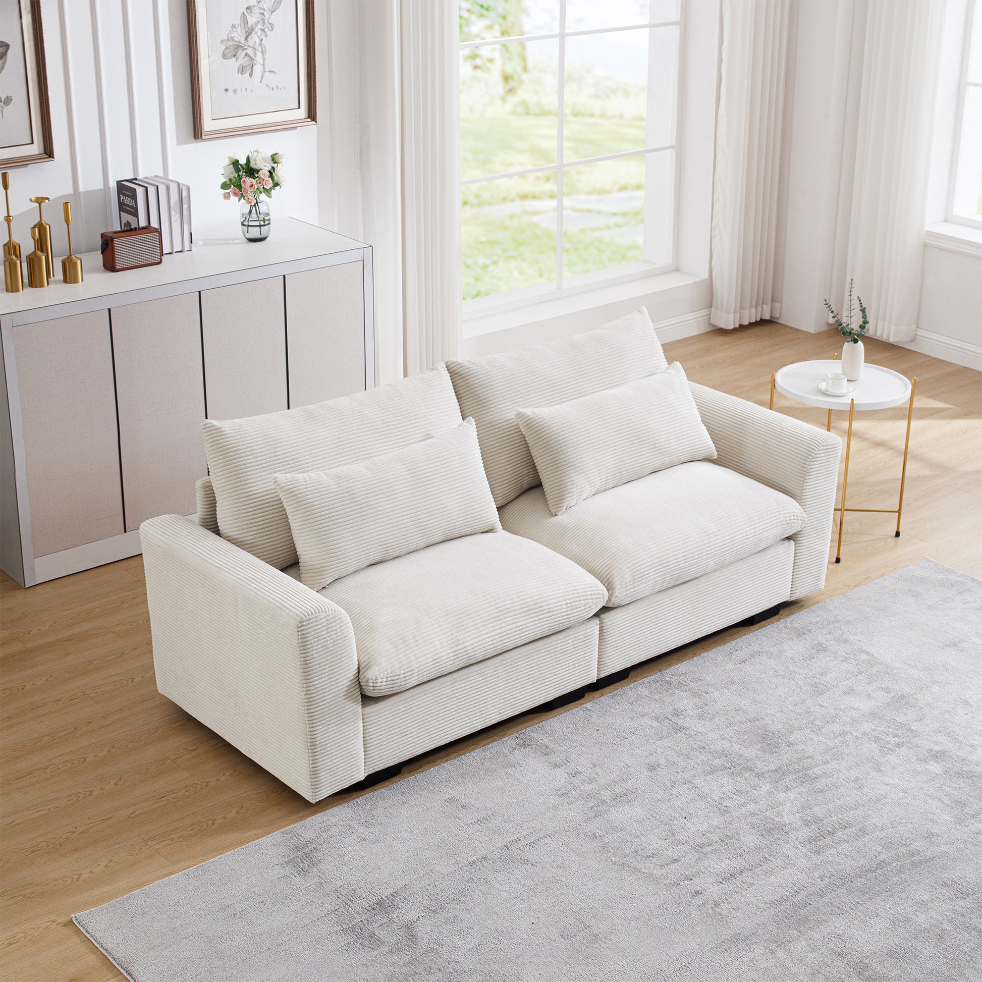 Offwhite corduroy sofa with plush cushions and a modern design perfect for living rooms