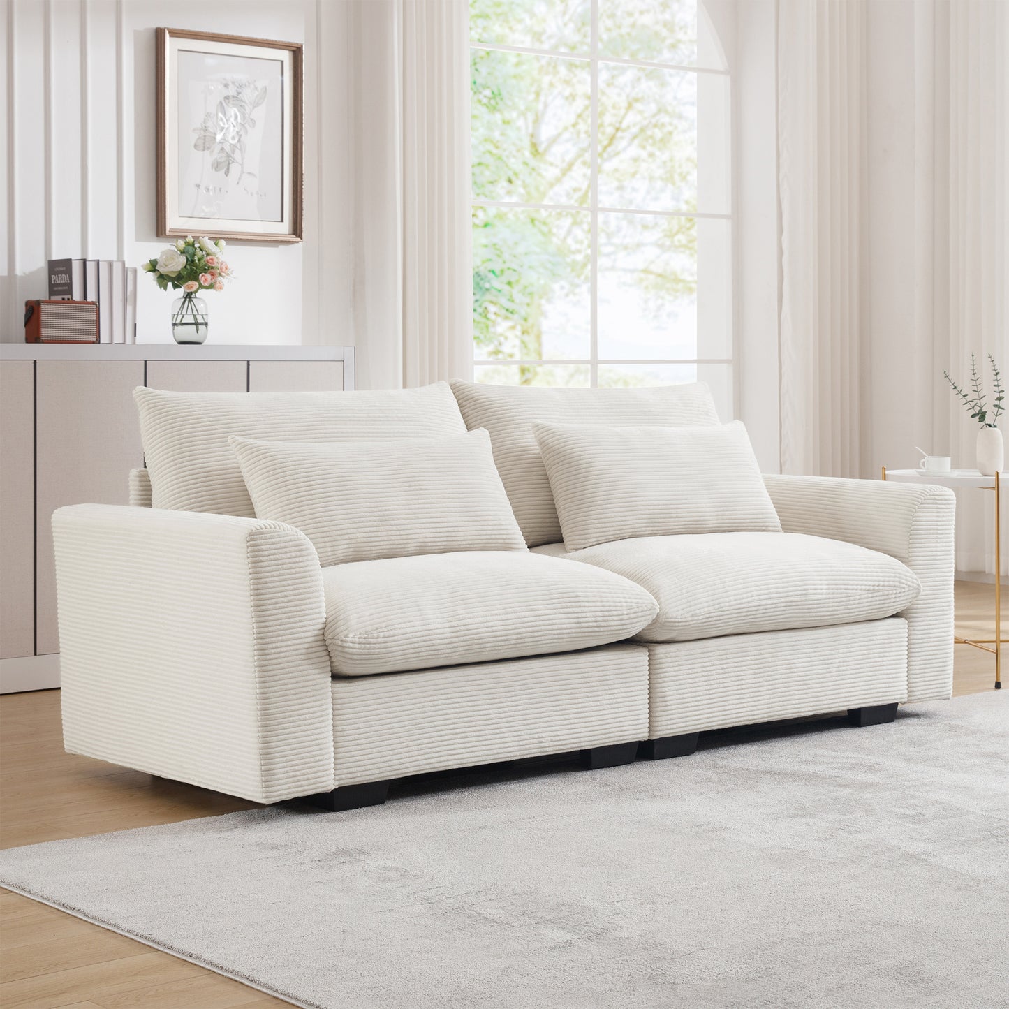 Plush cream corduroy sofa with deep seating and matching throw pillows perfect for a cozy living room