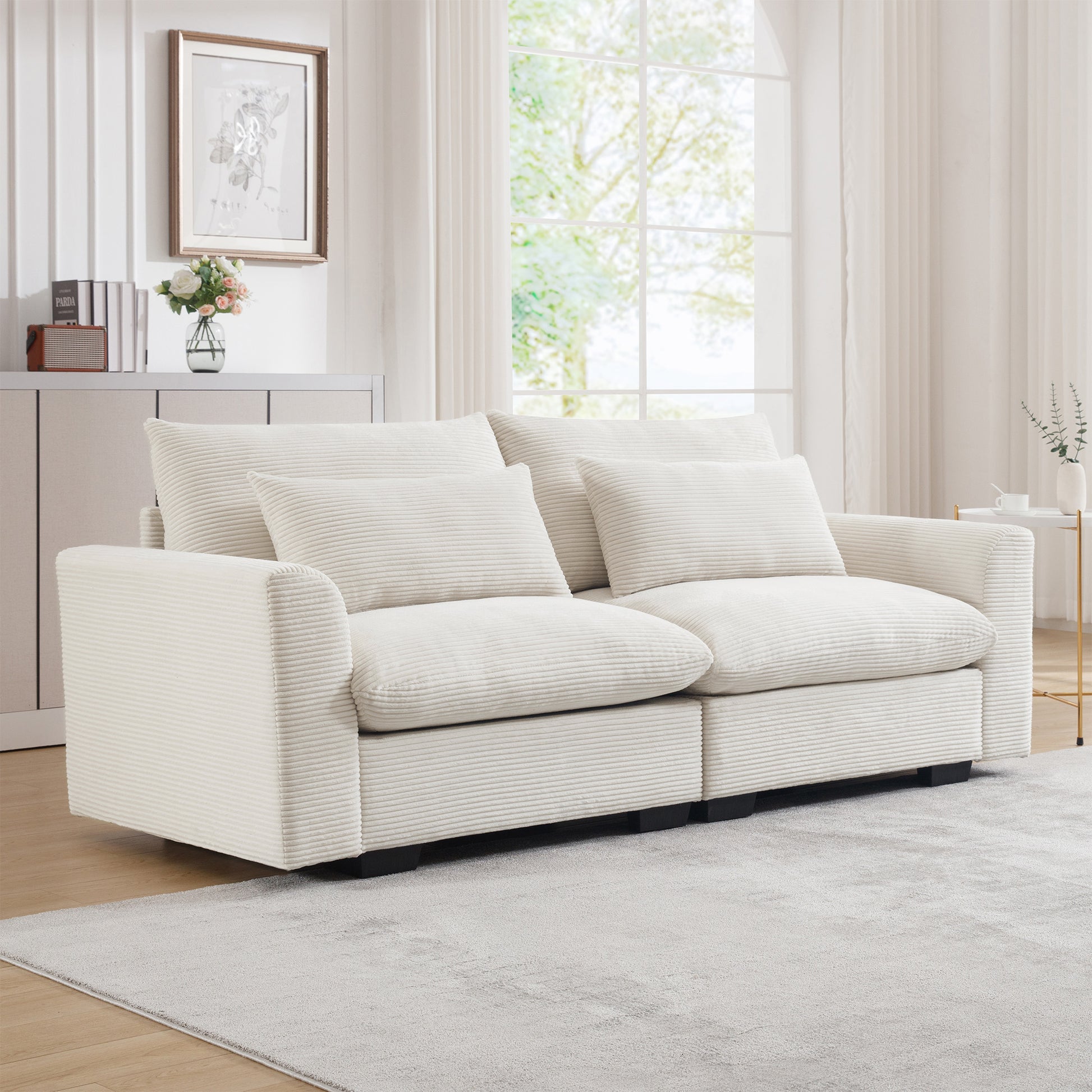 Plush cream corduroy sofa with deep seating and matching throw pillows perfect for a cozy living room