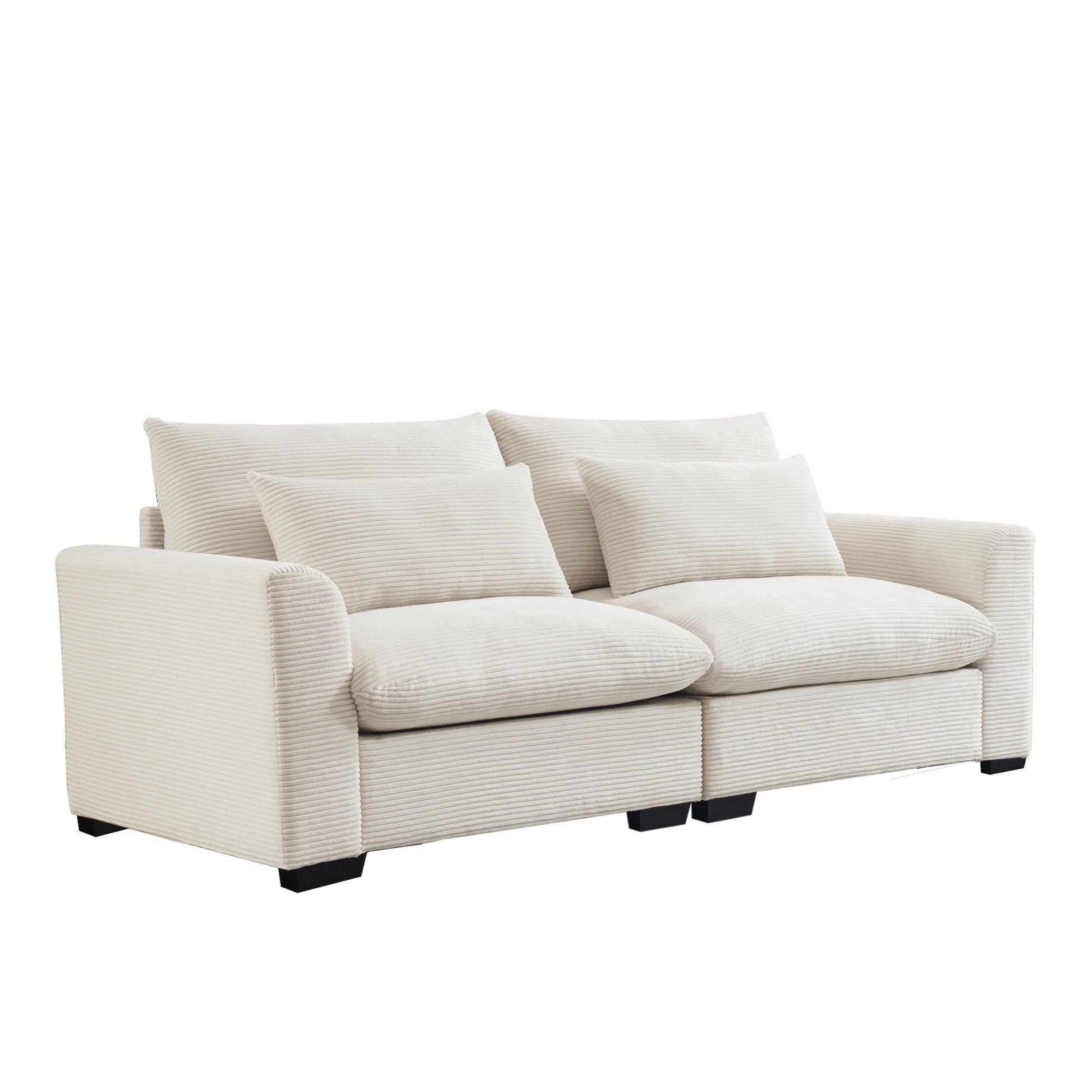 Cream corduroy twoseater sofa with plush cushions and modern black legs